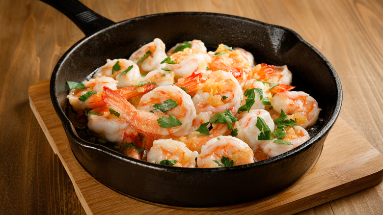 Skillet of garlic shrimp stir-fried in butter
