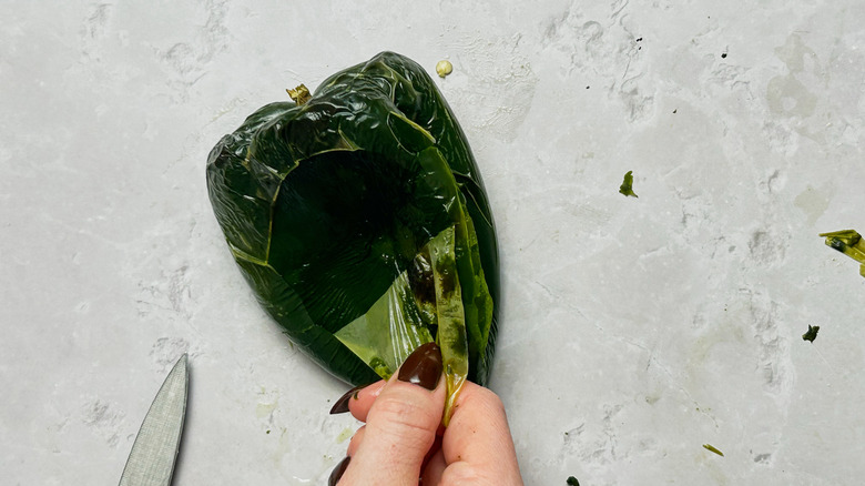 peeling the skin of a pepper