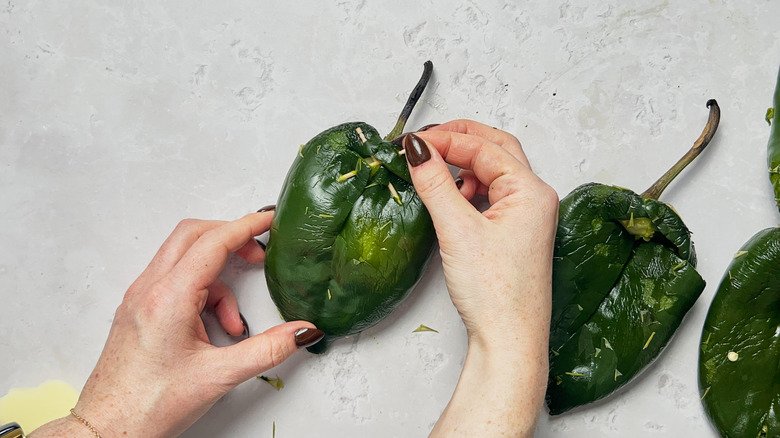 putting toothpicks into peppers