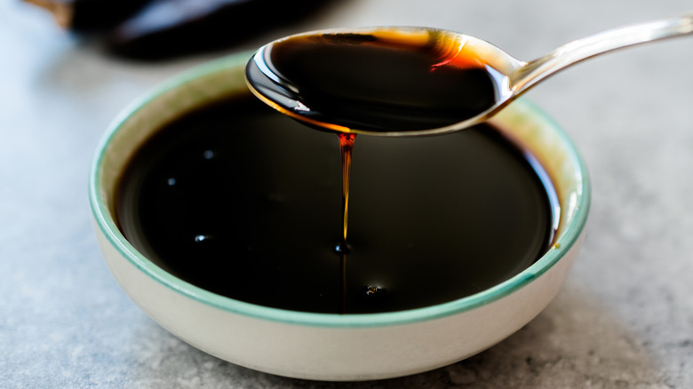molasses in a bowl with a spoon