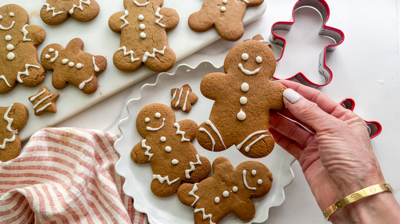 hand holding decorated gingerbread cookie