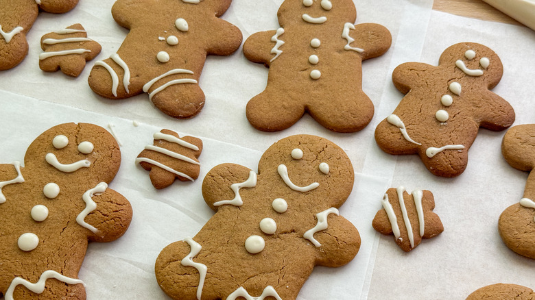 Decorated gingerbread cookies on parchment paper