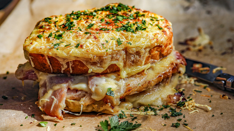 Toasty croque monseiur topped with herbs