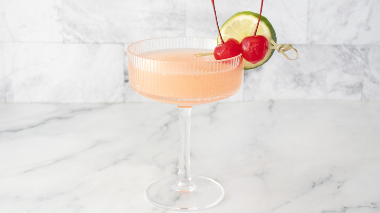 Garnished cocktail served in coupe glass