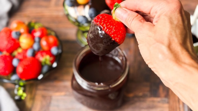 Strawberry dipped in classic hot fudge sauce