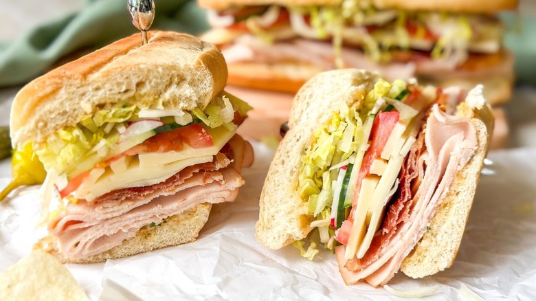 Classic Italian-ish club sub sandwich cut in half with layers exposed