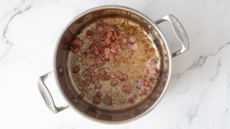 cooked bacon bits in a metal pot