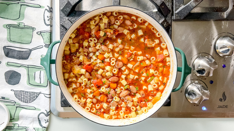 Pasta e fagioli in pot on stove with spoon