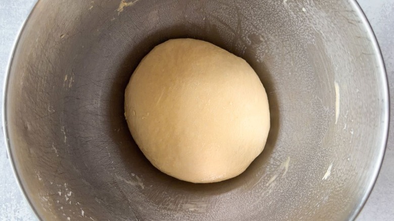 Beignet dough ball in a stand mixer bowl