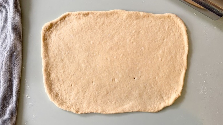 Beignet dough rolled out into a rectangle