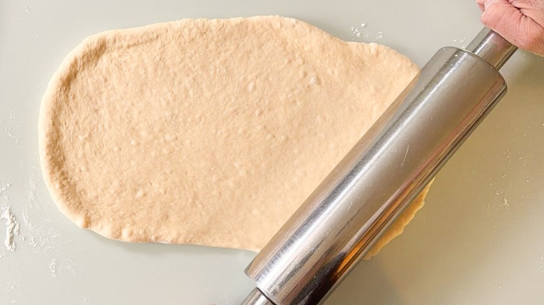 Rolling out beignet dough