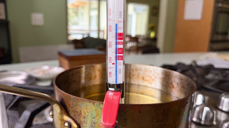 Thermometer in Dutch oven with oil heated to 360 F