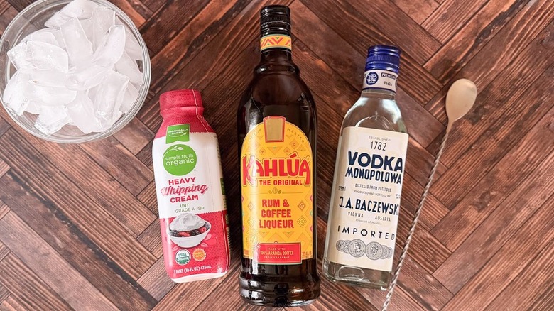 Classic white Russian cocktail ingredients on countertop