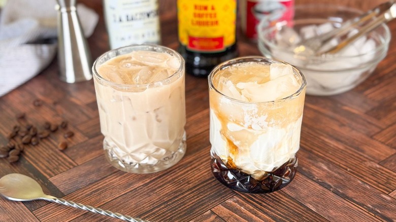 Classic white Russian cocktail and unstirred classic white Russian cocktail