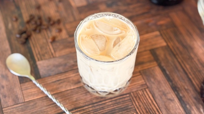 Classic White Russian cocktail in rocks glass with spoon