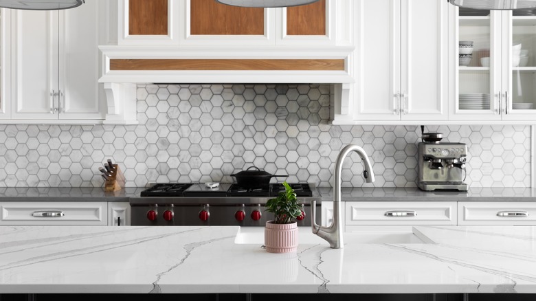 a kitchen with a marble counter