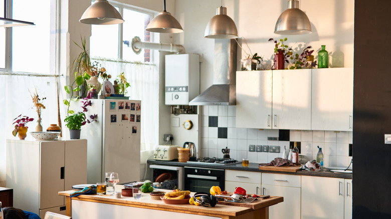 Modern day kitchen with with white color scheme and black accents