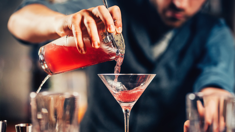 bartender pouring a cosmo