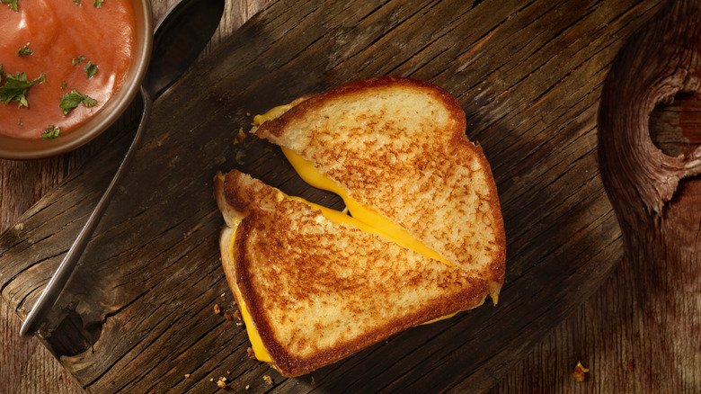 Grilled cheese sandwich on cutting board