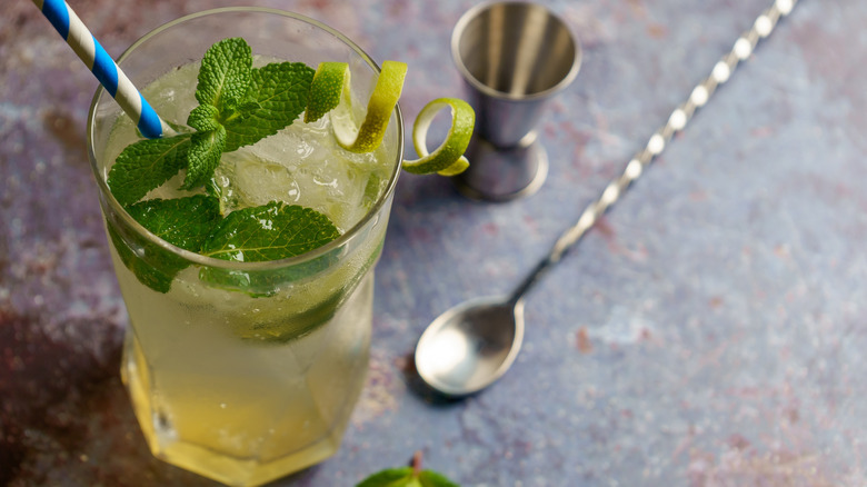 Mocktail with lime, fresh mint, and coconut water