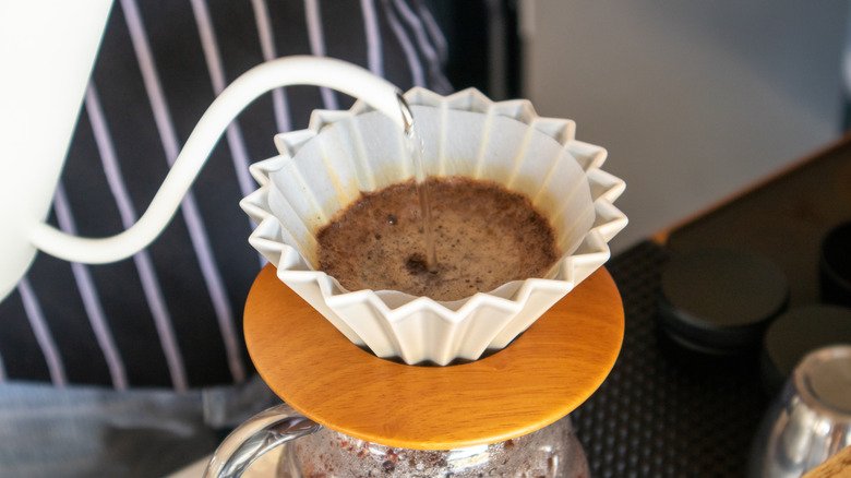Pouring water into coffee filter