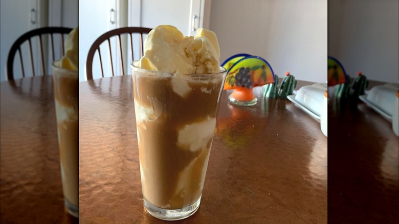 A homemade cold brew float sitting on a table