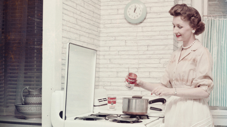 Vintage woman holding Campbell's soup