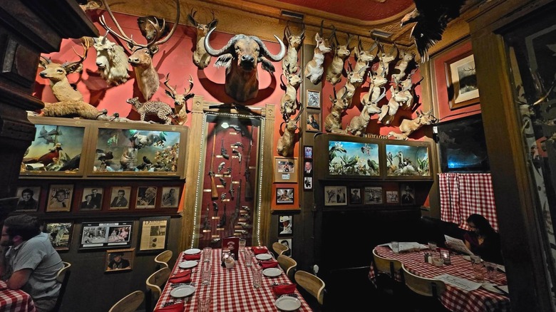 Dining area with taxidermy hanging on the walls at Buckhorn Exchange steakhouse in Denver