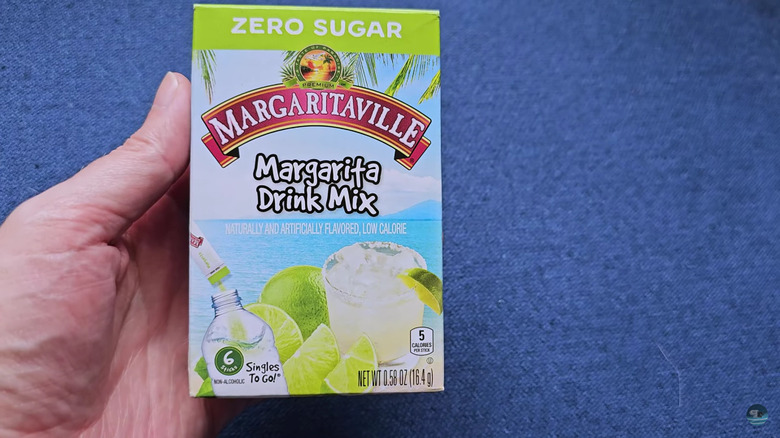box of margaritaville mix in hand