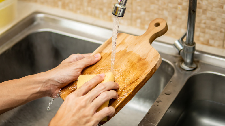 Cutting board washed in sink