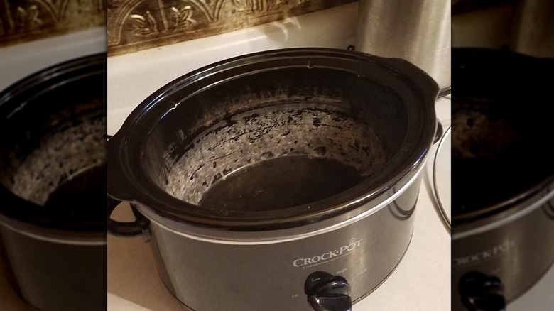 Black Crock-Pot with stained interior crock.
