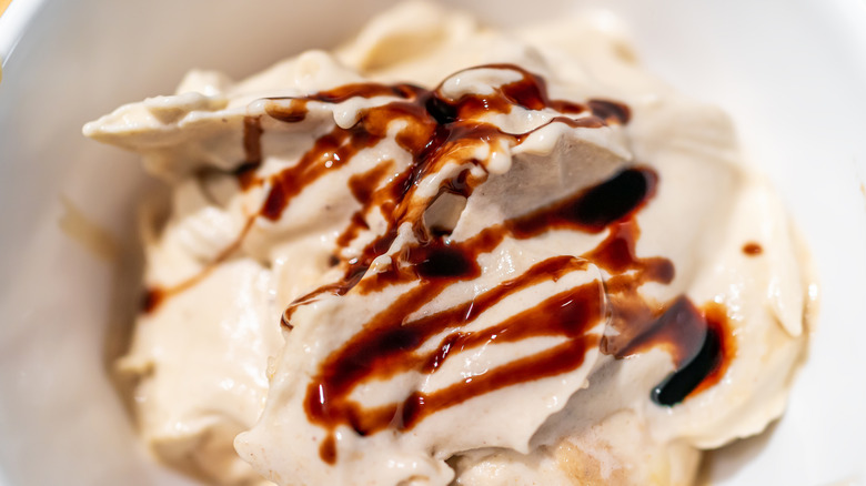 Close-up of vanilla ice cream with a balsamic drizzle