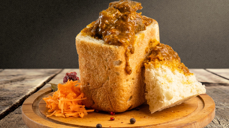 South African Bunny Chow made from hollowed-out bread filled with curry.