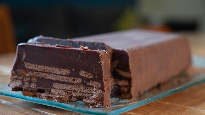Chocolate "Cold Dog" cake, or "Kalter hund" dessert, with a slice cut out of it