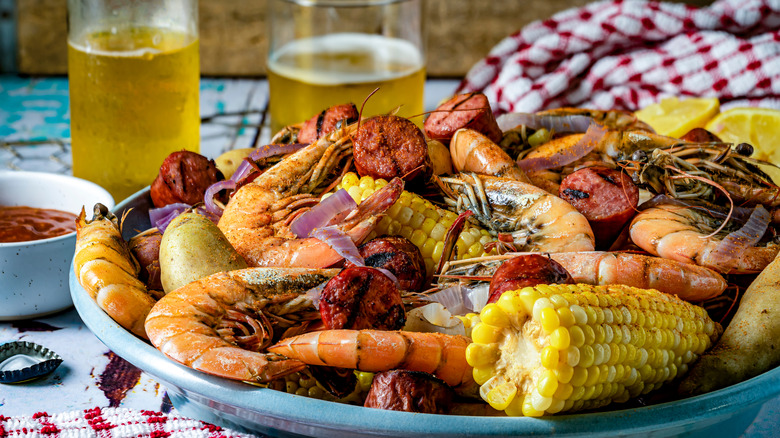 A bowl of Frogmore stew, containing shrimp and corn