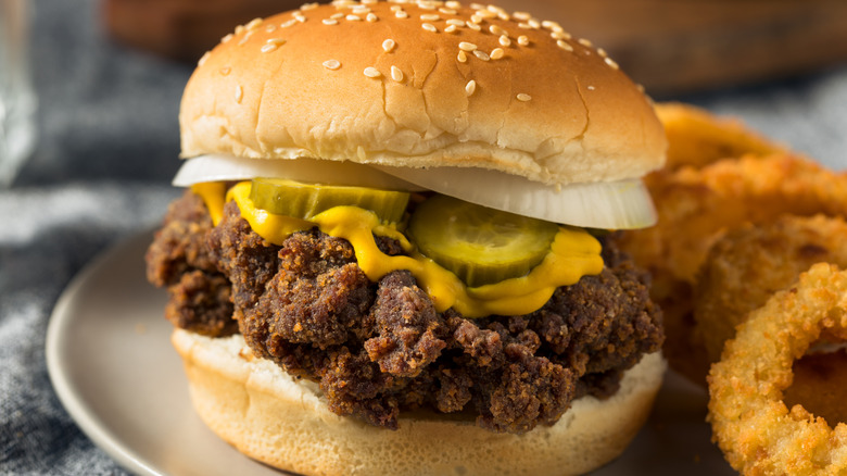 Homemade Mississippi Slugburgers with pickles, cheese, and onion rings