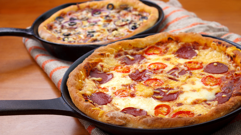 pizzas in cast iron skillets