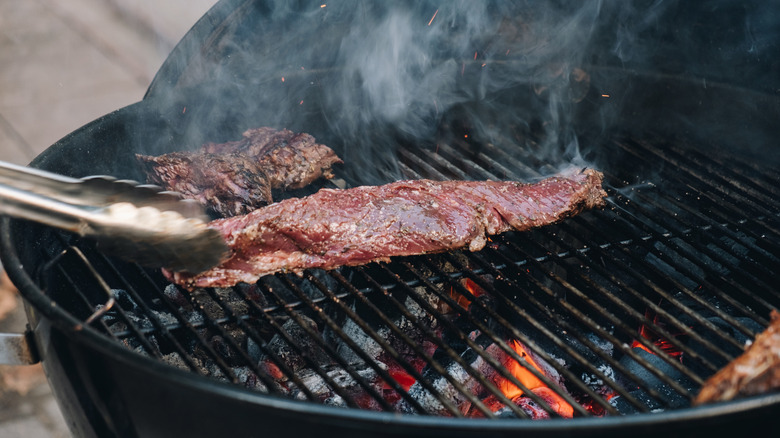 Skirt steak directly over flame on a grill