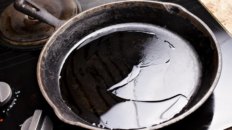 Oiled cast iron pan on stove