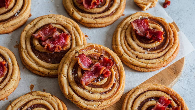 spiral-shaped cookies dotted with bacon