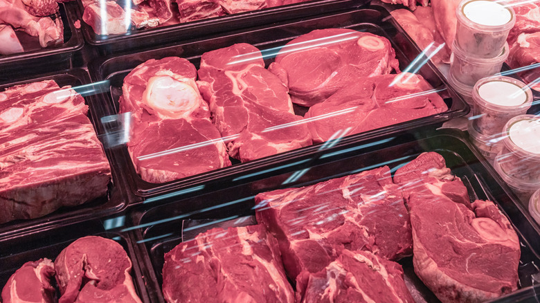 Different types of steaks in a display case