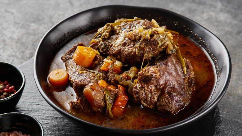 Pot roast on black plate
