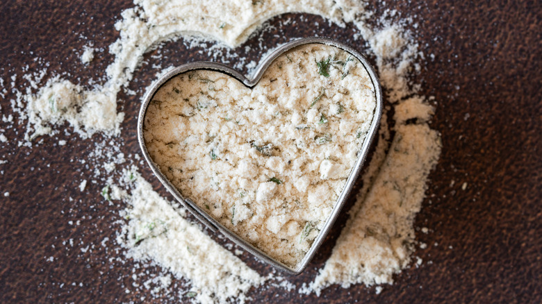 Ranch seasoning shaped into a heart, with tiny green herb flecks