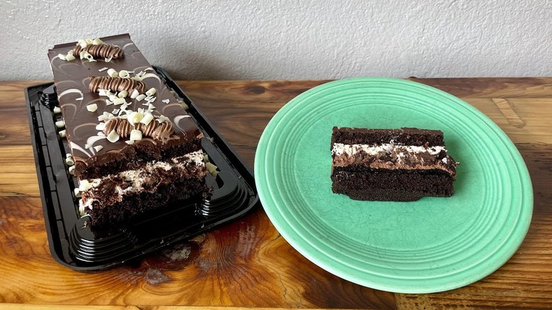 Costco's Tuxedo Chocolate Mousse Cake with a slice on a green plate