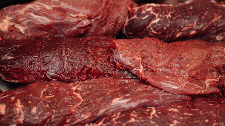 Multiple large raw cuts of beef