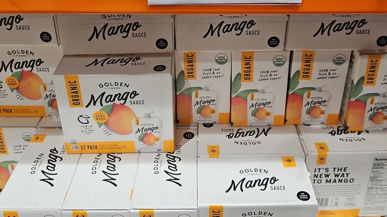 A display of Golden Farms Organic Mango Sauce at Costco
