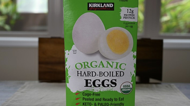 A box of Kirkland Signature Organic Hard-Boiled Eggs sitting on a countertop