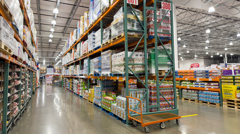 Inside of Costco warehouse with shelves and other products on display.