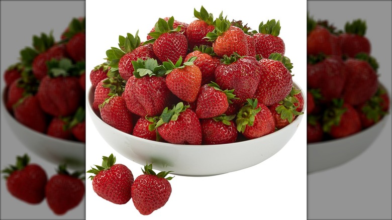 White bowl of fresh strawberries.