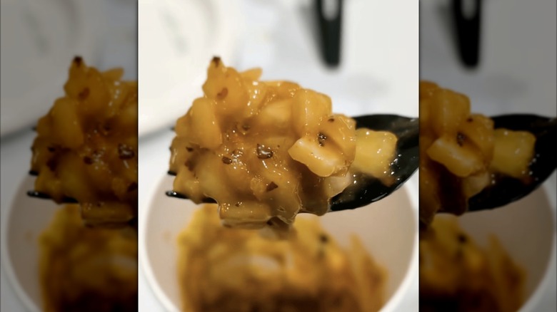 Costco kimchi sauce on a plastic fork